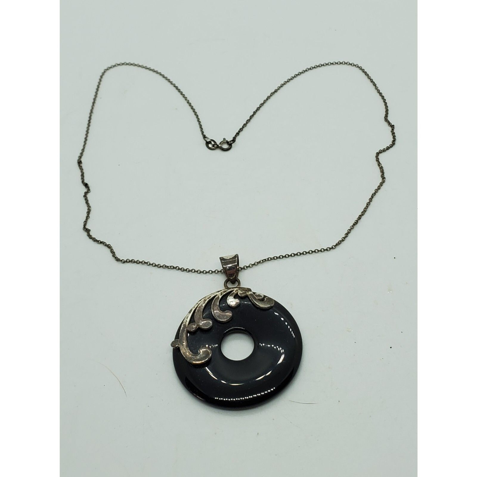 Round Black Buddha Stone With Silver Color Design On Circle